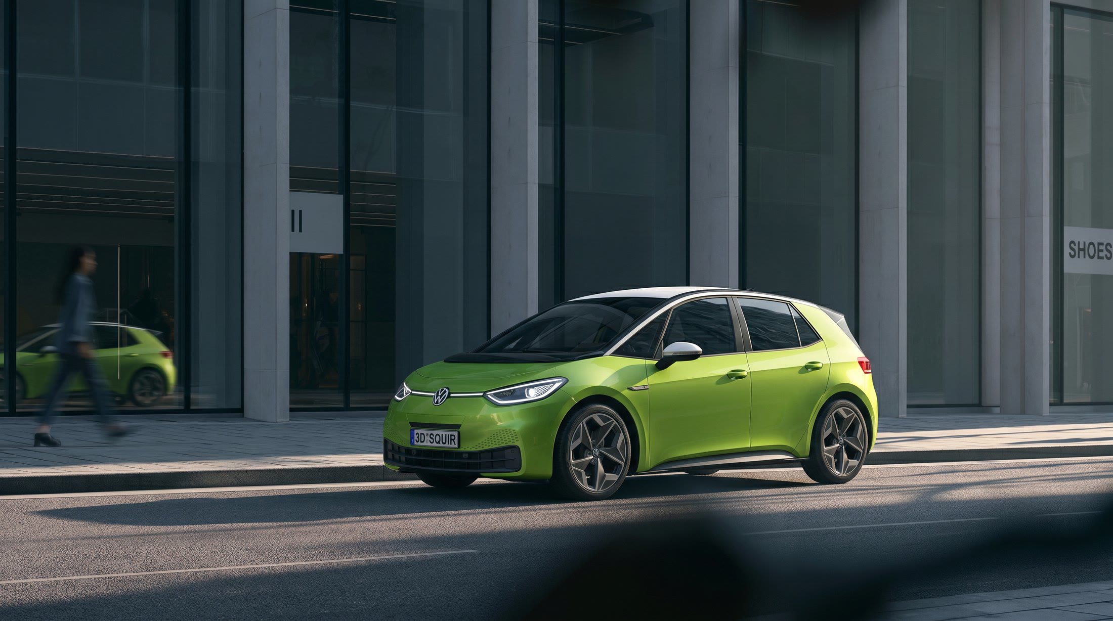 Lime green hatchback outside a concrete building